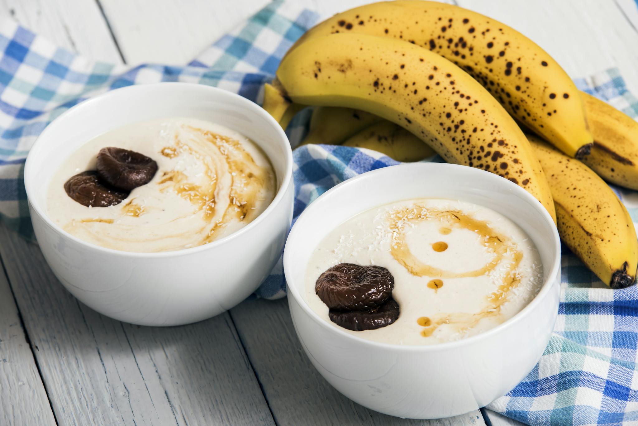 Healthy breakfast yogurt with bananas and figs, drizzled with syrup, perfect for a sweet start.